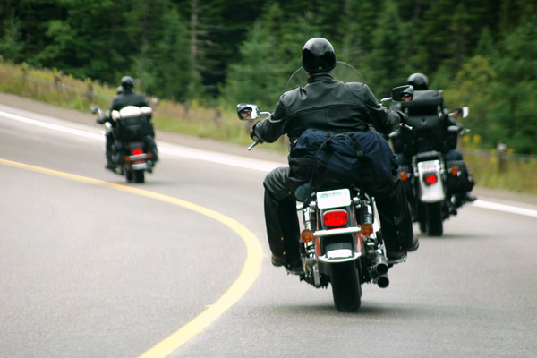 A photo of three bikers riding motorcycles who would benefit from motorcycle insurance