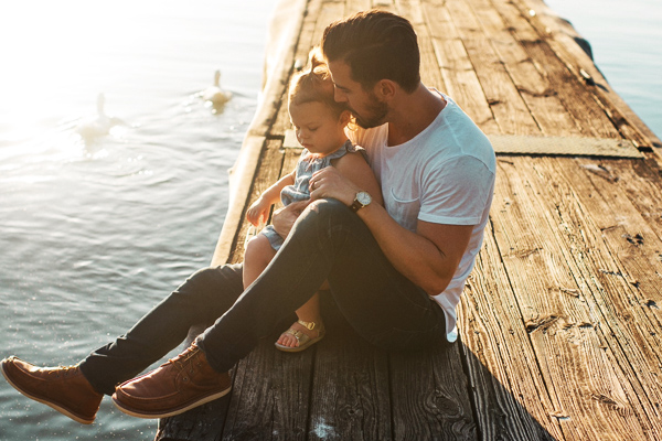 A photo of a man and child - Links to Life Insurance page