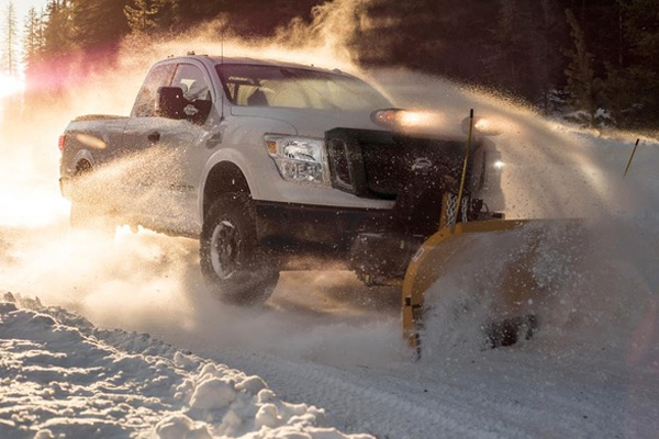 Photo of a truck with snow plow, reinforcing the need for snow plow insurance in Massachusetts