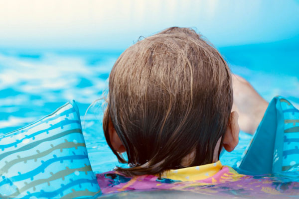 Photo of child swimming in pool - Links to corresponding blog post